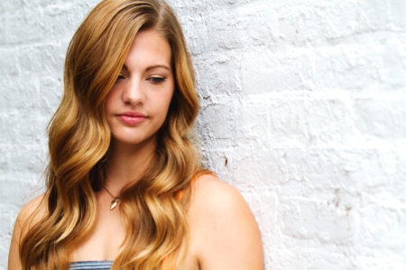 Andrea-Looking-Down-White-Wall