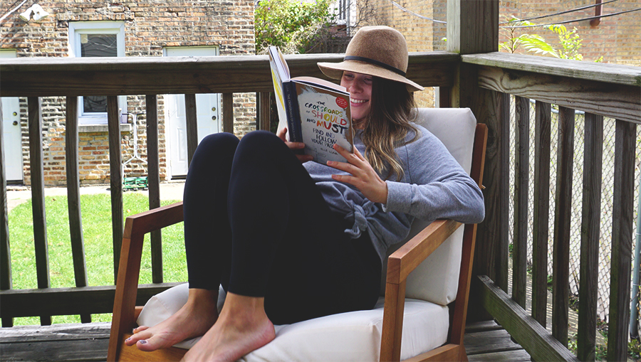 Young-Woman-Reading-Smiling