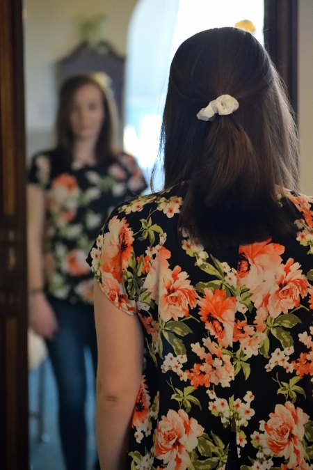 woman-looking-into-mirror-reflection